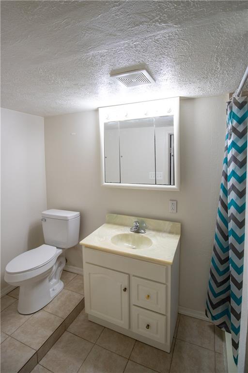 2111 Lewis Run Road Clairton, PA 15025 - Photo 15 of 17 a bathroom with a toilet sink and mirror