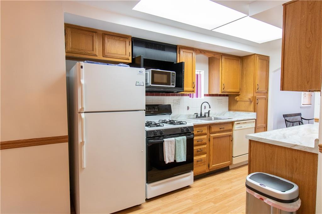 2111 Lewis Run Road Clairton, PA 15025 - Photo 8 of 17 a kitchen with stainless steel appliances granite countertop a refrigerator stove top oven a sink and dishwasher