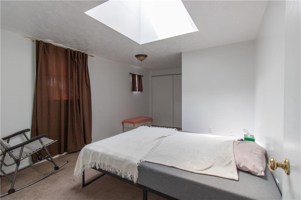 2111 Lewis Run Road Clairton, PA 15025 - Photo 9 of 17 a bedroom with a bed and a window