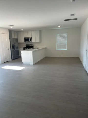 a view of a kitchen with a sink cabinets and window