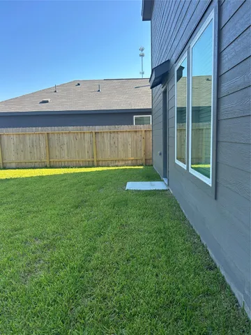 a view of a back yard of the house
