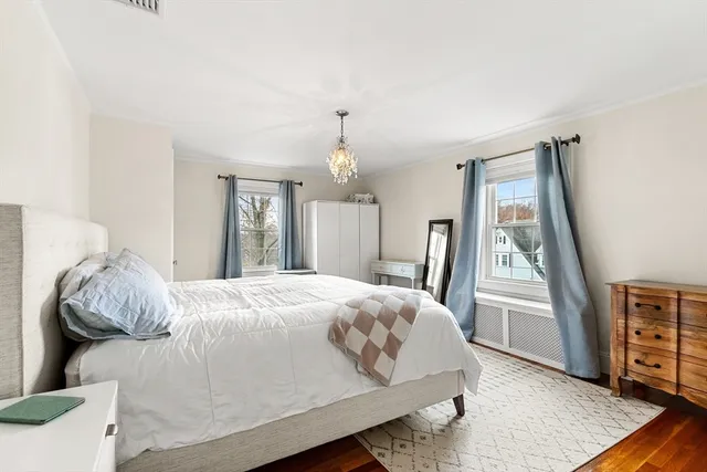 a bed room with a bed and a window