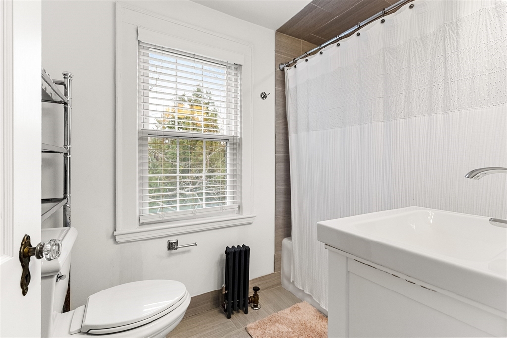 33 Ashcroft Road Medford, MA 02155 - Photo 21 of 30 a bathroom with a sink a toilet and shower