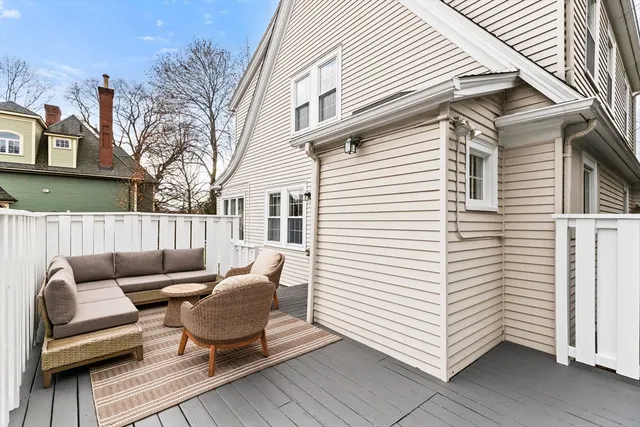 a view of house and yard with wooden fence