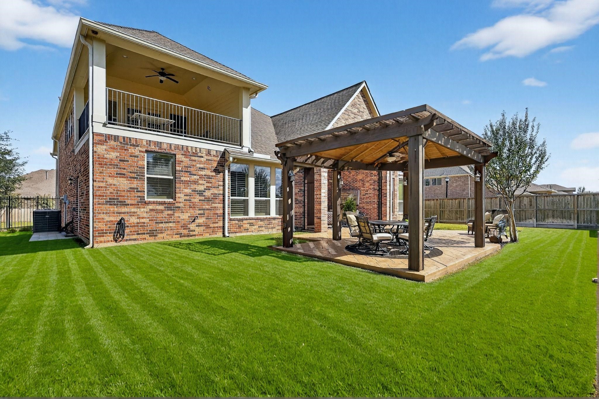 25803 Heritage Maple Drive Spring, TX 77389 - Photo 45 of 46 a view of a house with backyard porch and sitting area