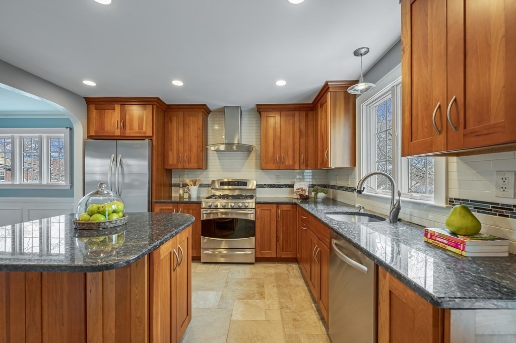 38 Cerdan Avenue Boston, MA 02132 - Photo 13 of 40 a kitchen with stainless steel appliances granite countertop a sink stove and refrigerator