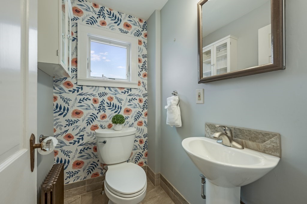 38 Cerdan Avenue Boston, MA 02132 - Photo 14 of 40 a bathroom with a toilet sink and mirror