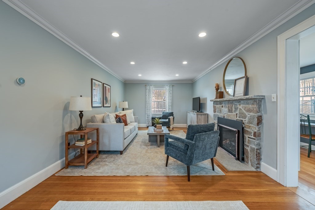 38 Cerdan Avenue Boston, MA 02132 - Photo 16 of 40 a living room with furniture and a fireplace