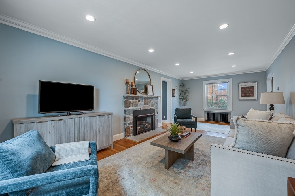 38 Cerdan Avenue Boston, MA 02132 - Photo 17 of 40 a living room with fireplace furniture and a flat screen tv