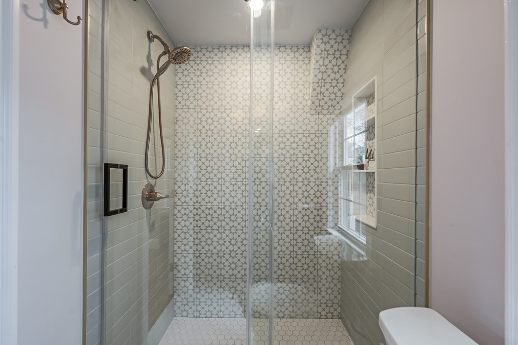 38 Cerdan Avenue Boston, MA 02132 - Photo 26 of 40 a bathroom with a shower and toilet