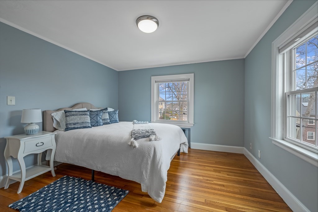 38 Cerdan Avenue Boston, MA 02132 - Photo 31 of 40 a bedroom with a bed and wooden floor