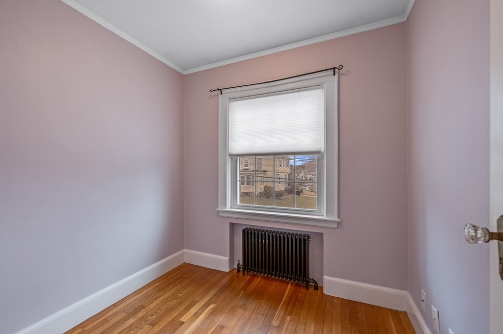 38 Cerdan Avenue Boston, MA 02132 - Photo 33 of 40 a view of an empty room with wooden floor and a window