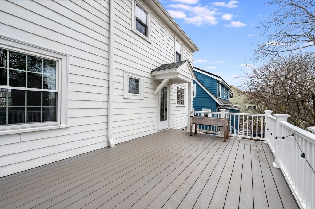 38 Cerdan Avenue Boston, MA 02132 - Photo 36 of 40 a view of a house with wooden deck and a chair