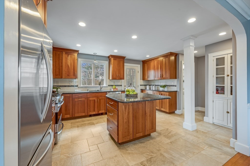 38 Cerdan Avenue Boston, MA 02132 - Photo 7 of 40 a kitchen with stainless steel appliances granite countertop a refrigerator and a sink