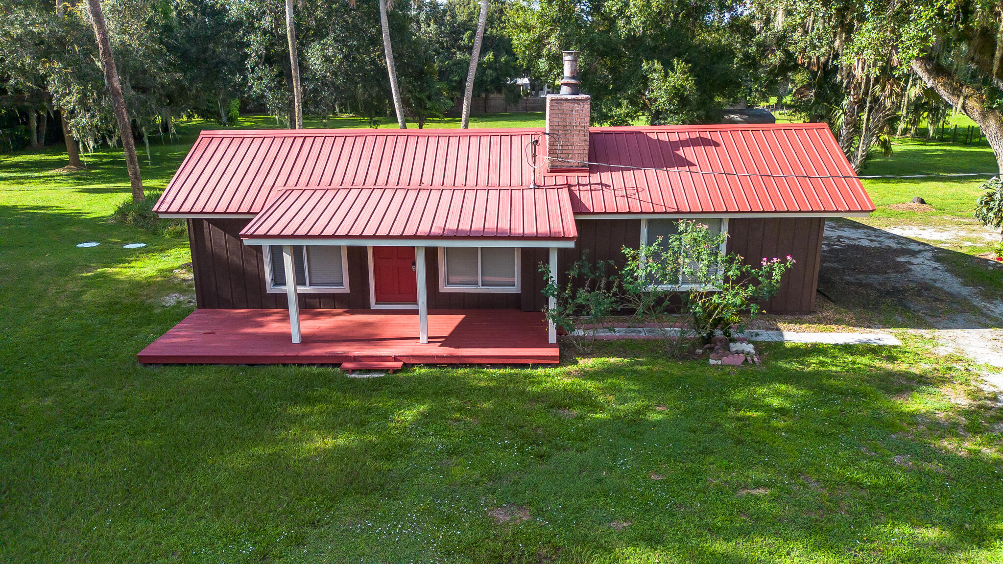 a front view of a house with a yard table and chairs