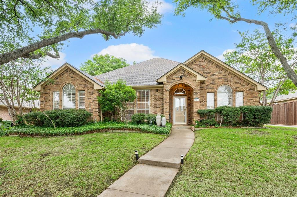 924 Hardie Street Hurst, TX 76053 - Photo 1 of 32 a front view of a house with garden