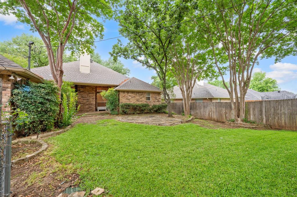 924 Hardie Street Hurst, TX 76053 - Photo 2 of 32 a view of house with backyard and outdoor seating