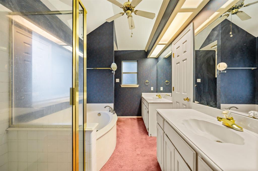 924 Hardie Street Hurst, TX 76053 - Photo 21 of 32 a bathroom with a sink a toilet and shower