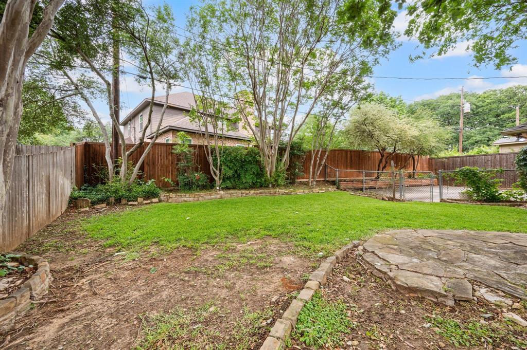 924 Hardie Street Hurst, TX 76053 - Photo 30 of 32 a view of a backyard with palm trees