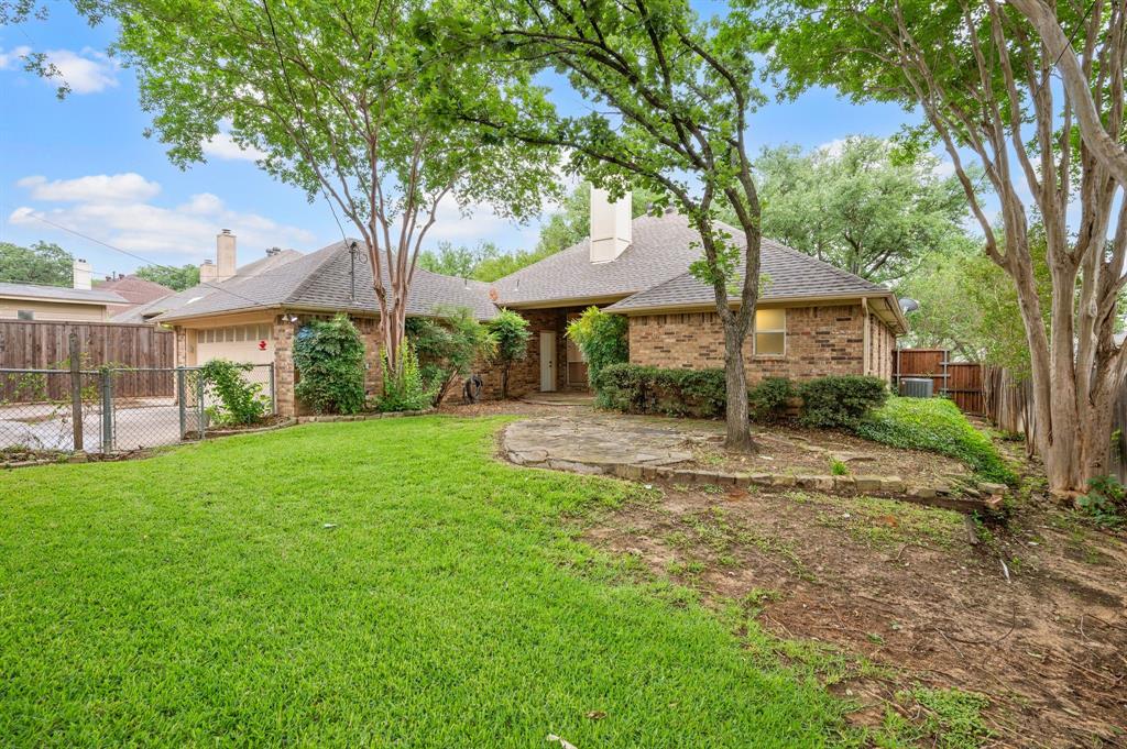 924 Hardie Street Hurst, TX 76053 - Photo 31 of 32 a view of a patio with a tree
