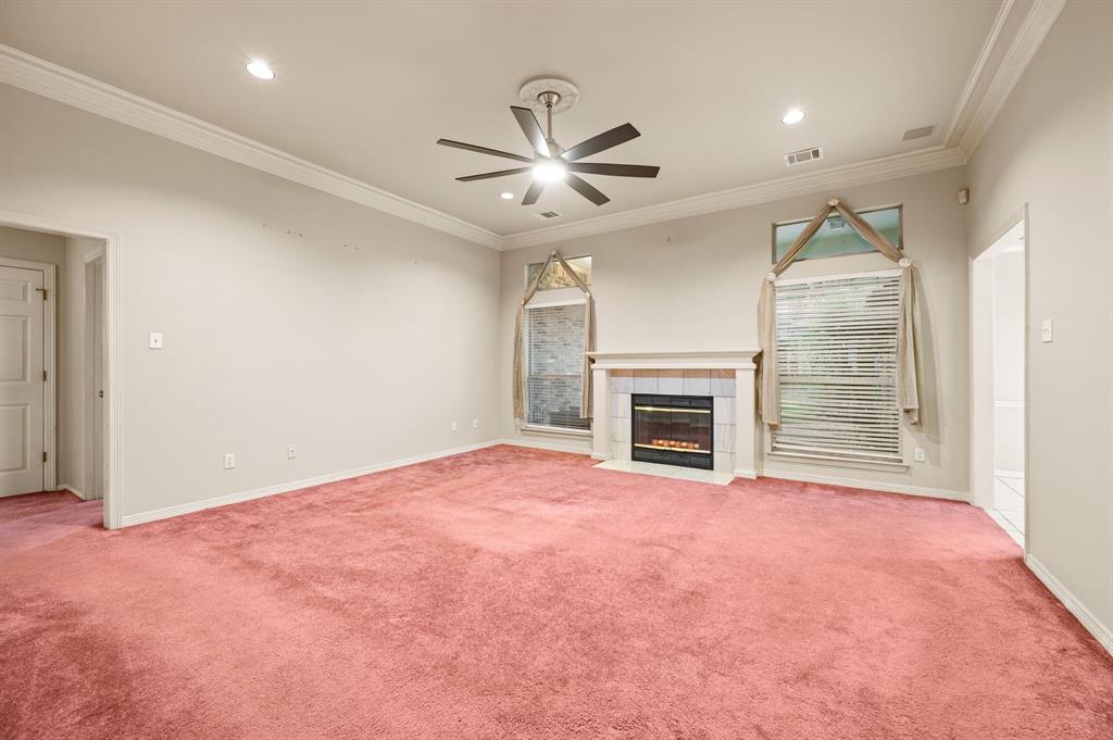 924 Hardie Street Hurst, TX 76053 - Photo 5 of 32 a view of an empty room with a fireplace and a window