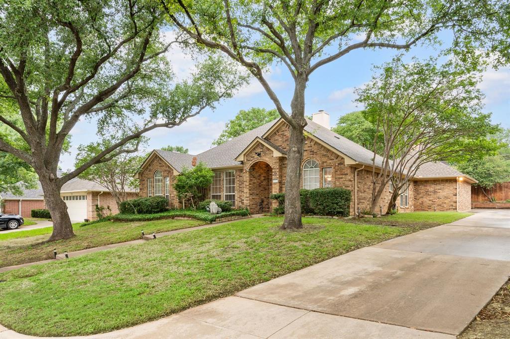 924 Hardie Street Hurst, TX 76053 - Photo 6 of 32 a front view of a house with a yard