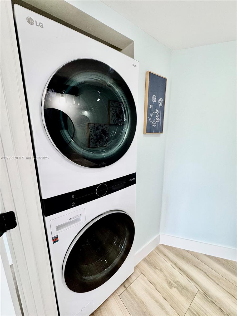 2415 Northwest 16th St Road, Unit 101 Miami, FL 33125 - Photo 18 of 36 a close up view of a washer and dryer