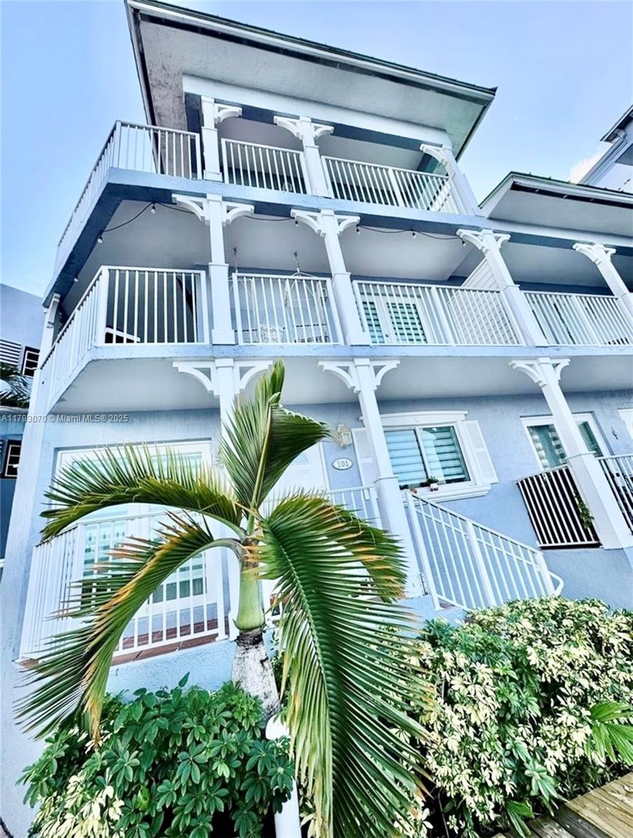 2415 Northwest 16th St Road, Unit 101 Miami, FL 33125 - Photo 2 of 36 a view of a balcony with furniture