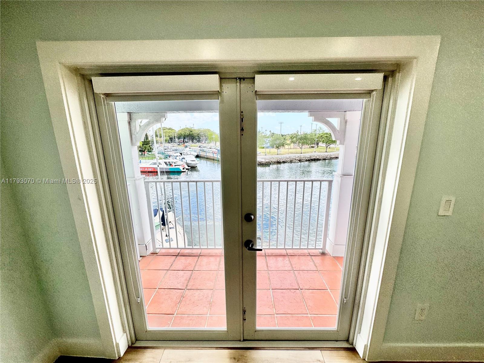 2415 Northwest 16th St Road, Unit 101 Miami, FL 33125 - Photo 26 of 36 a view of a wooden door