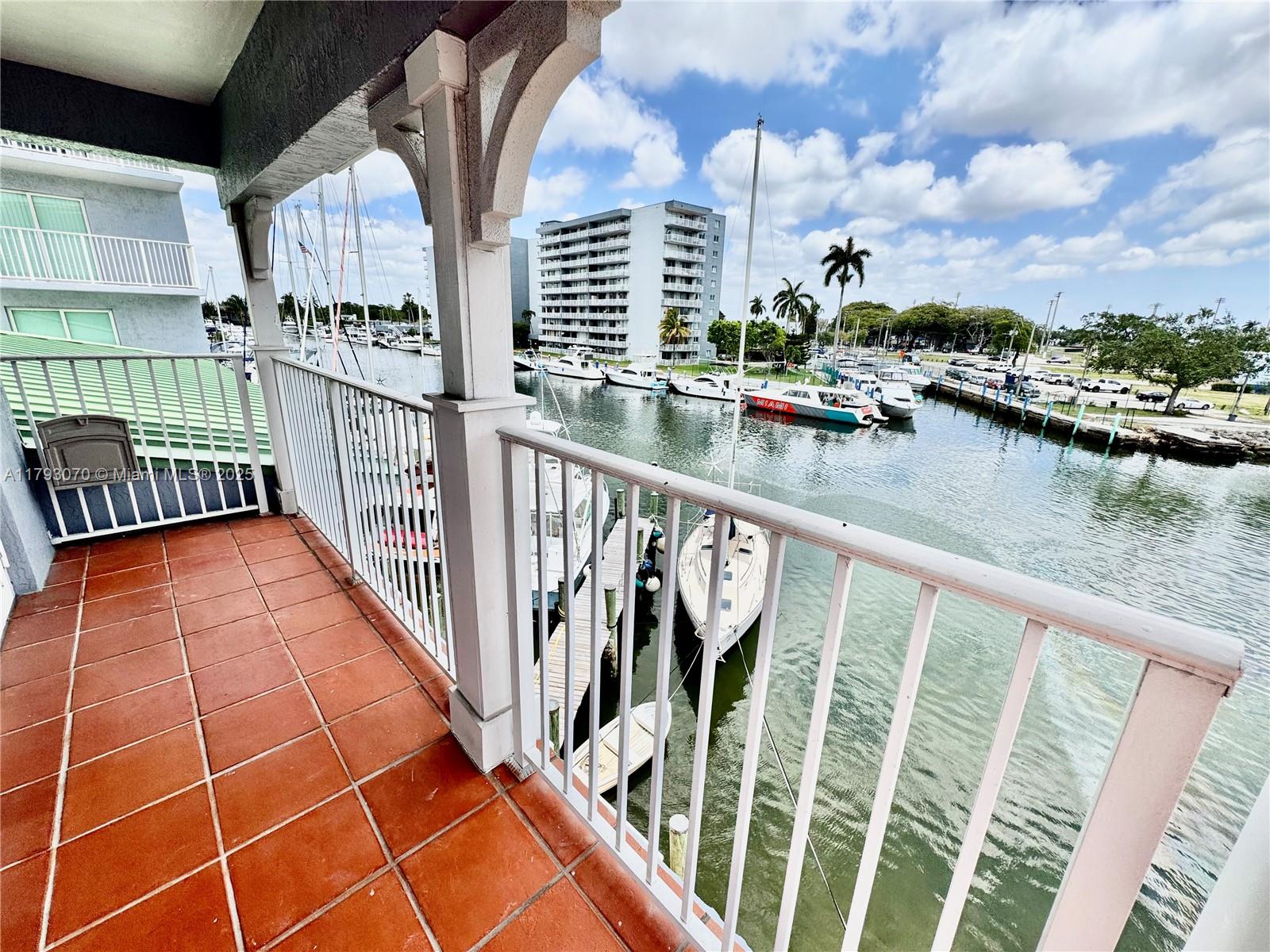 2415 Northwest 16th St Road, Unit 101 Miami, FL 33125 - Photo 28 of 36 a view of swimming pool from a balcony