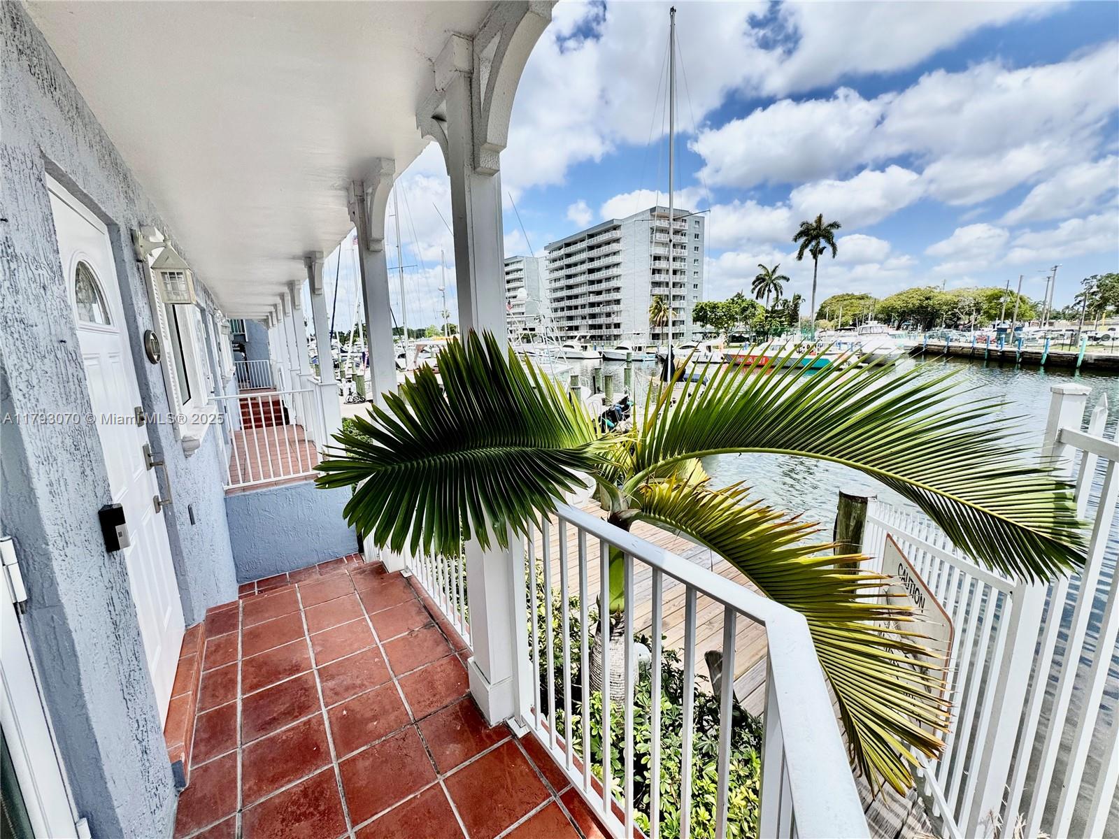 2415 Northwest 16th St Road, Unit 101 Miami, FL 33125 - Photo 29 of 36 a view of balcony with a potted plant