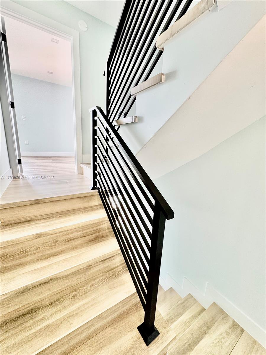 2415 Northwest 16th St Road, Unit 101 Miami, FL 33125 - Photo 30 of 36 a view of wooden floor