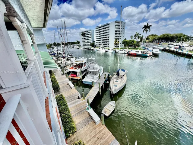 a view of swimming pool with outdoor seating and city view