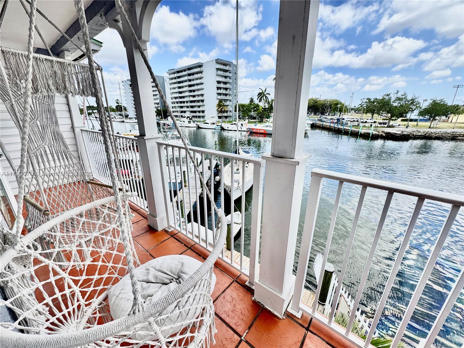 2415 Northwest 16th St Road, Unit 101 Miami, FL 33125 - Photo 31 of 36 a view of balcony with furniture