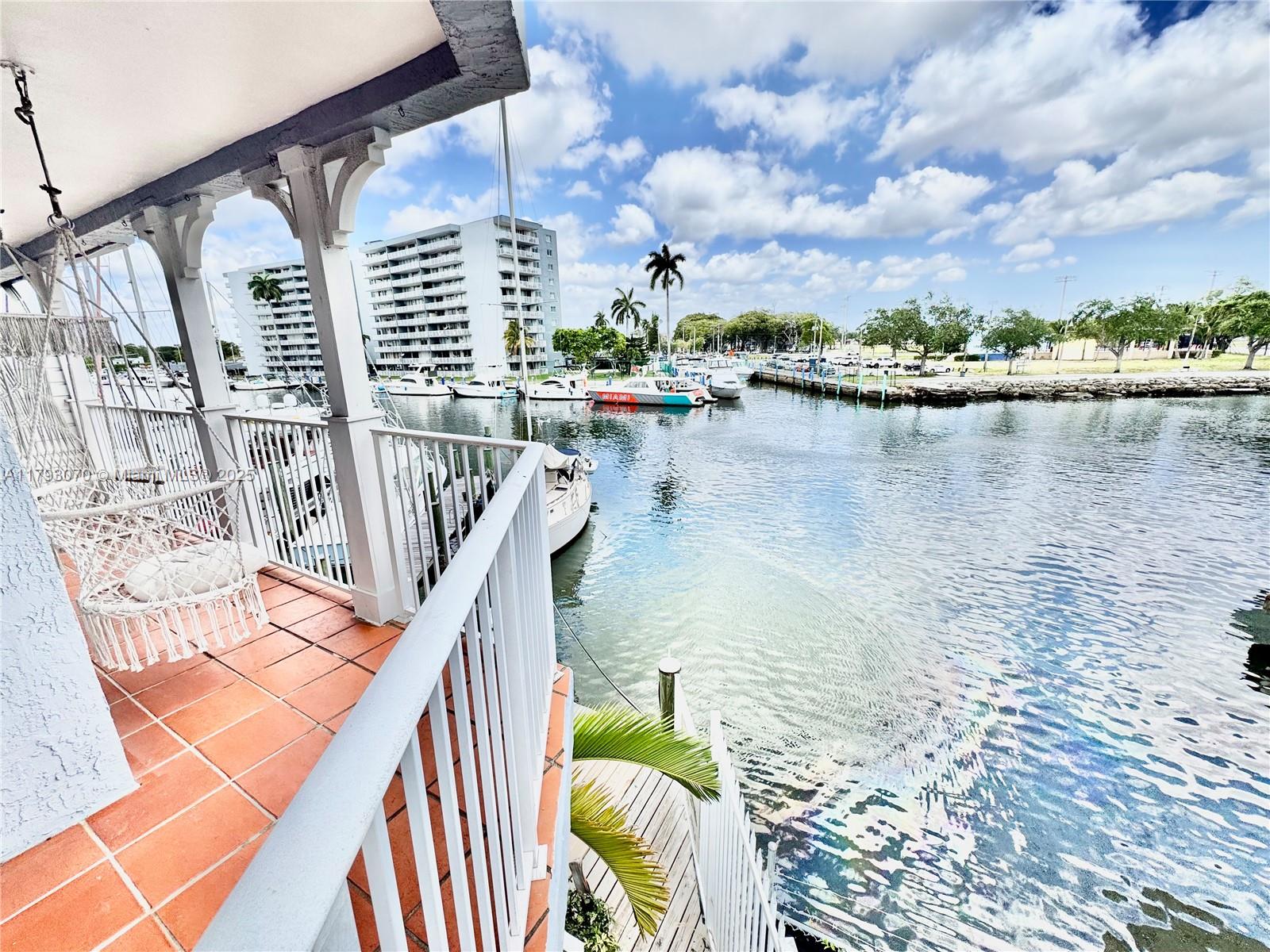 2415 Northwest 16th St Road, Unit 101 Miami, FL 33125 - Photo 32 of 36 a view of swimming pool from a balcony