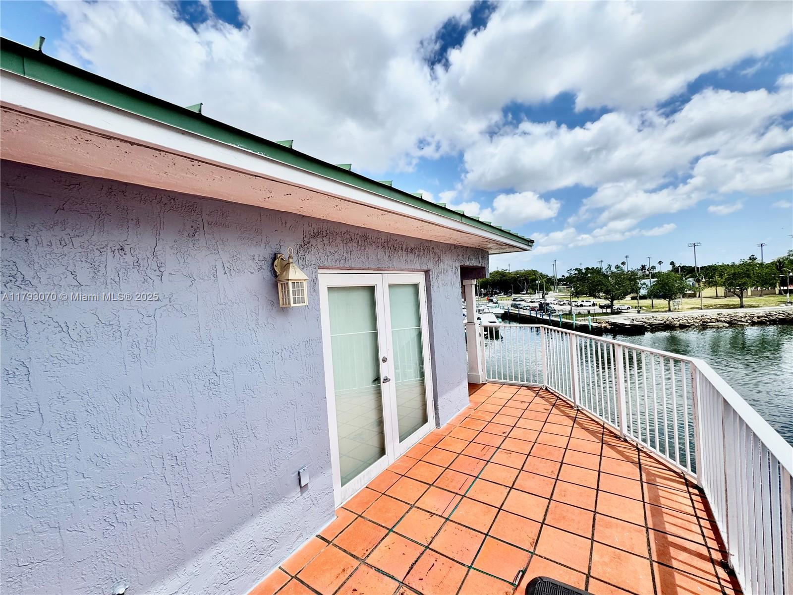 2415 Northwest 16th St Road, Unit 101 Miami, FL 33125 - Photo 36 of 36 a balcony view with a lake view