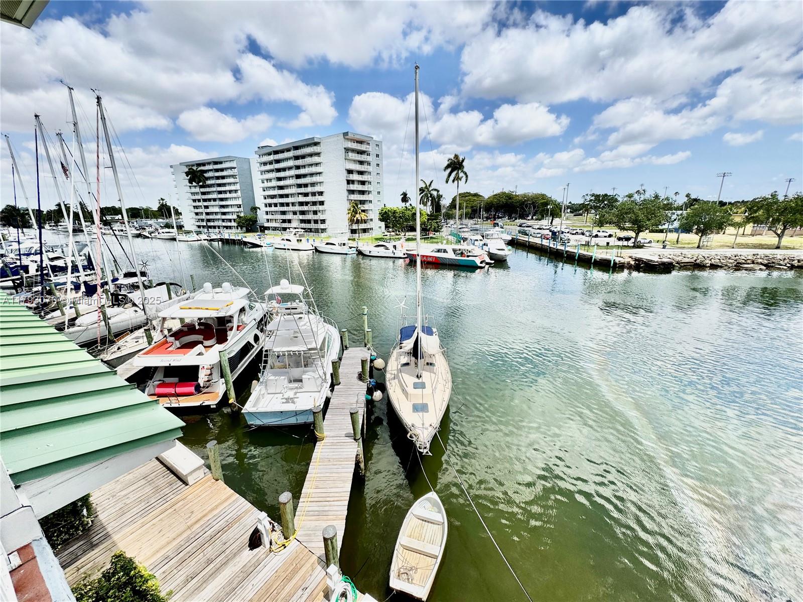 2415 Northwest 16th St Road, Unit 101 Miami, FL 33125 - Photo 4 of 36 a view of a lake with sitting area