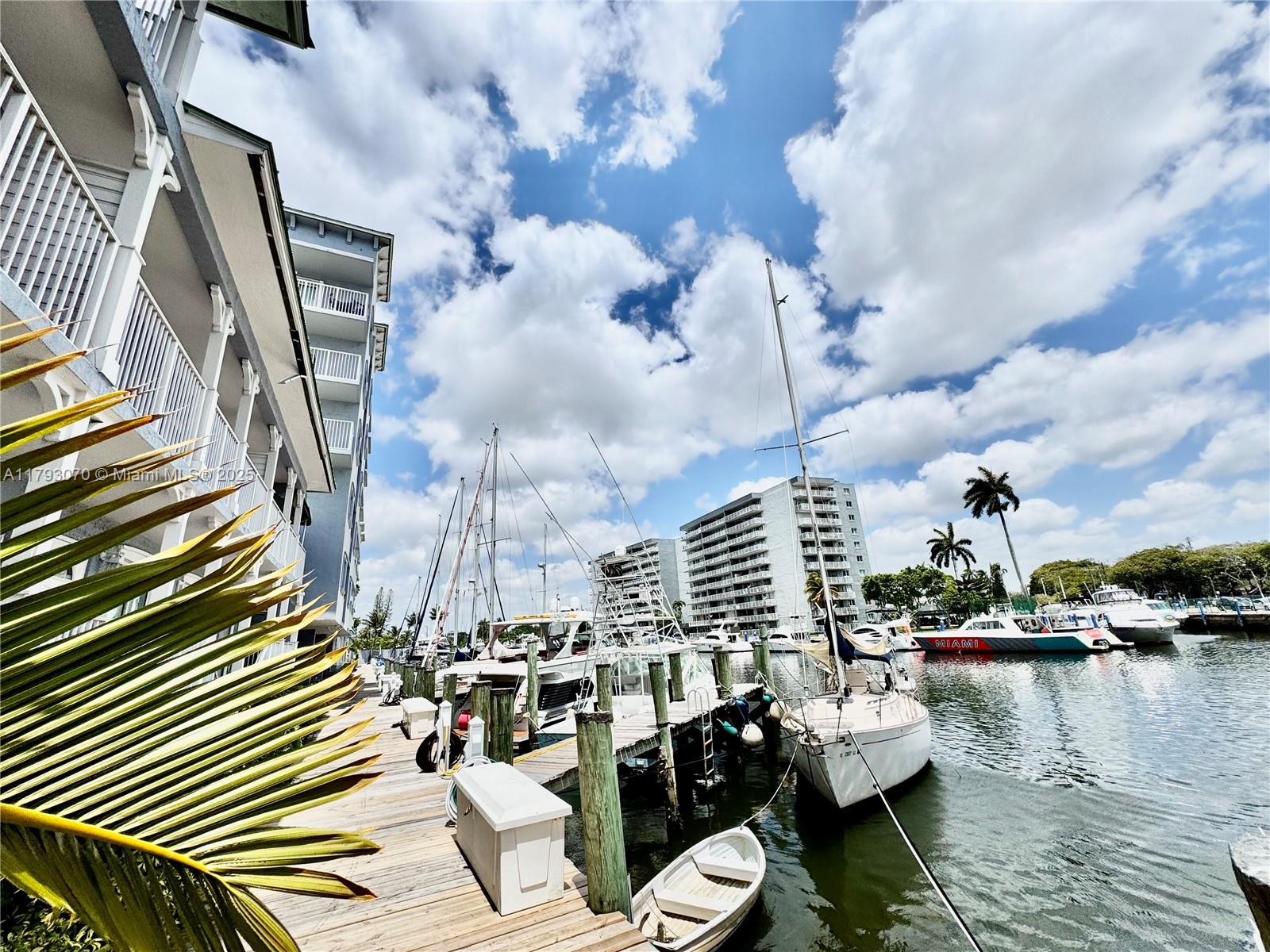 2415 Northwest 16th St Road, Unit 101 Miami, FL 33125 - Photo 6 of 36 a view of a lake with sitting area