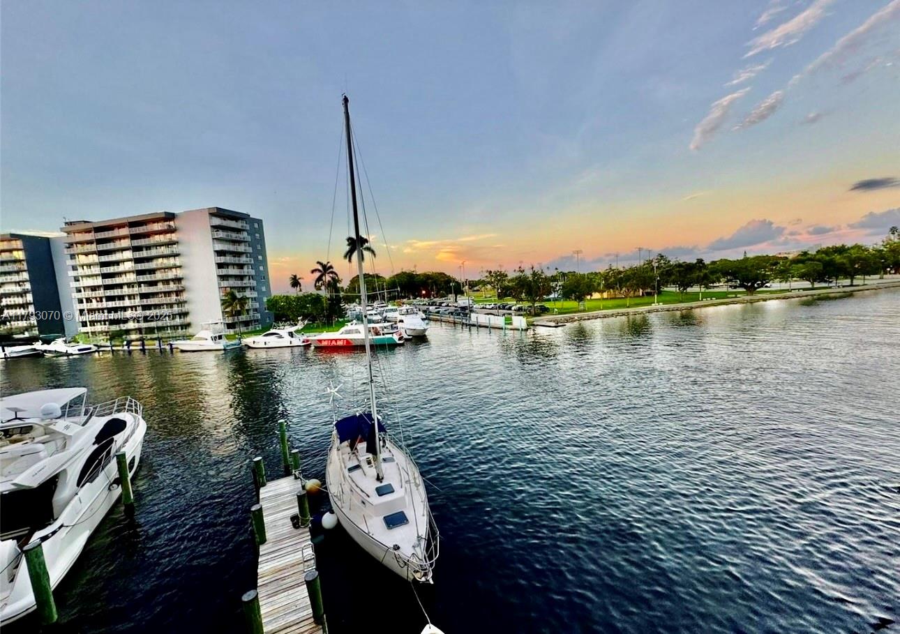 2415 Northwest 16th St Road, Unit 101 Miami, FL 33125 - Photo 8 of 36 a view of a lake with tall buildings