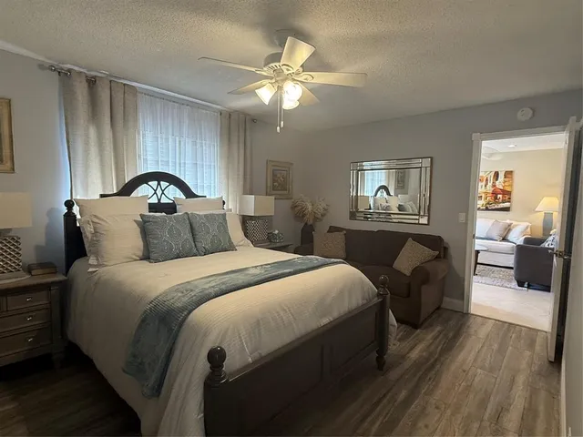 a bedroom with bed and window