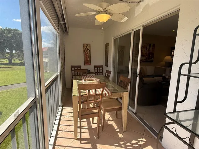 a view of a balcony with chairs