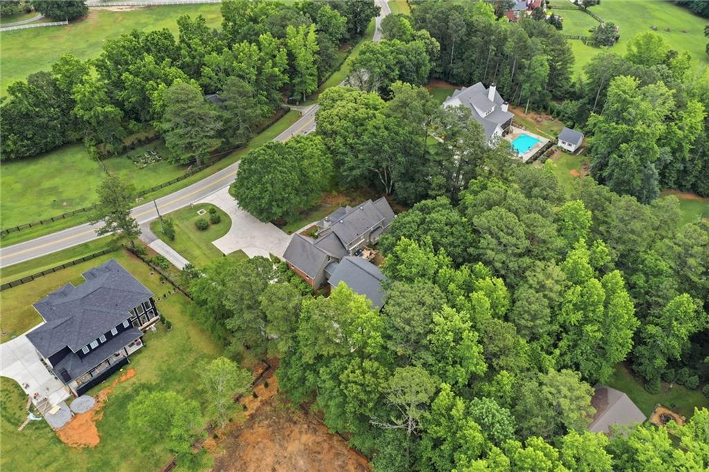 4891 Bill Cheek Road Auburn, GA 30011 - Photo 71 of 99 an aerial view of a house with a yard