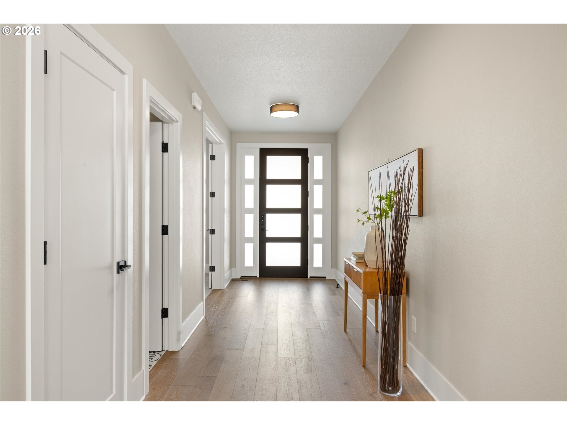 14551 Southwest 153rd Avenue Portland, OR 97224 - Photo 10 of 45 a view of a hallway with wooden floor and a livingroom view