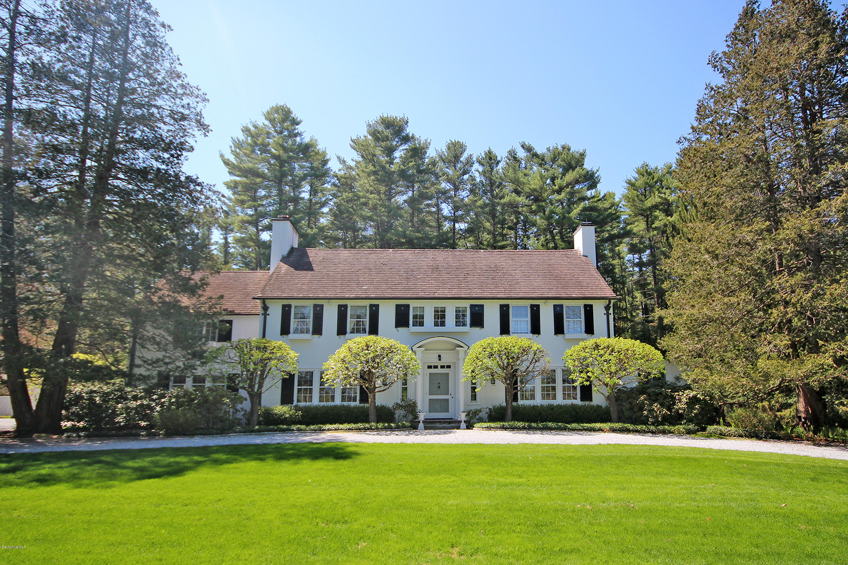 6 Glendale Road Stockbridge, MA 01229 - Photo 2 of 45 a front view of a house with garden and trees