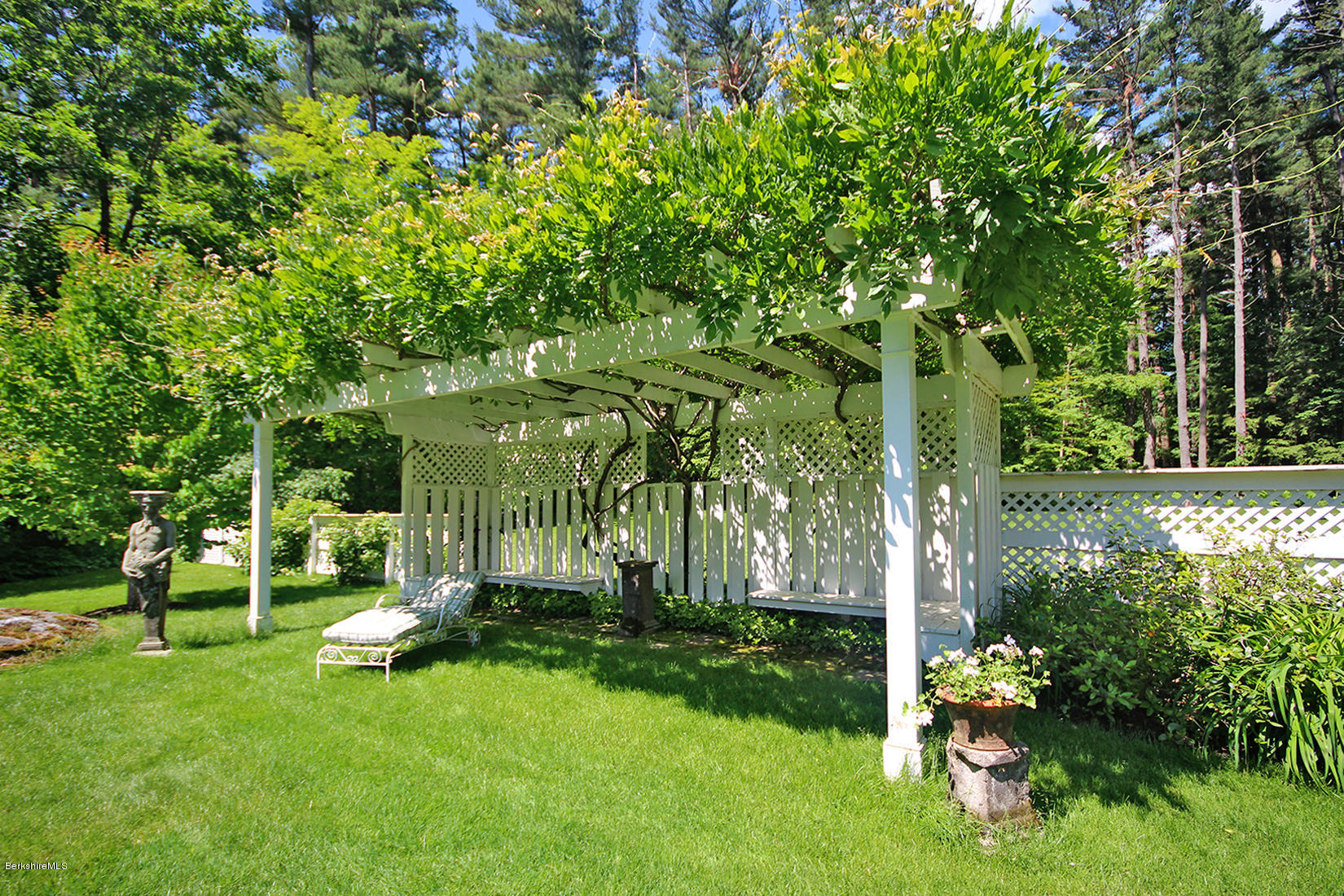 6 Glendale Road Stockbridge, MA 01229 - Photo 13 of 45 a garden with trees in front of it