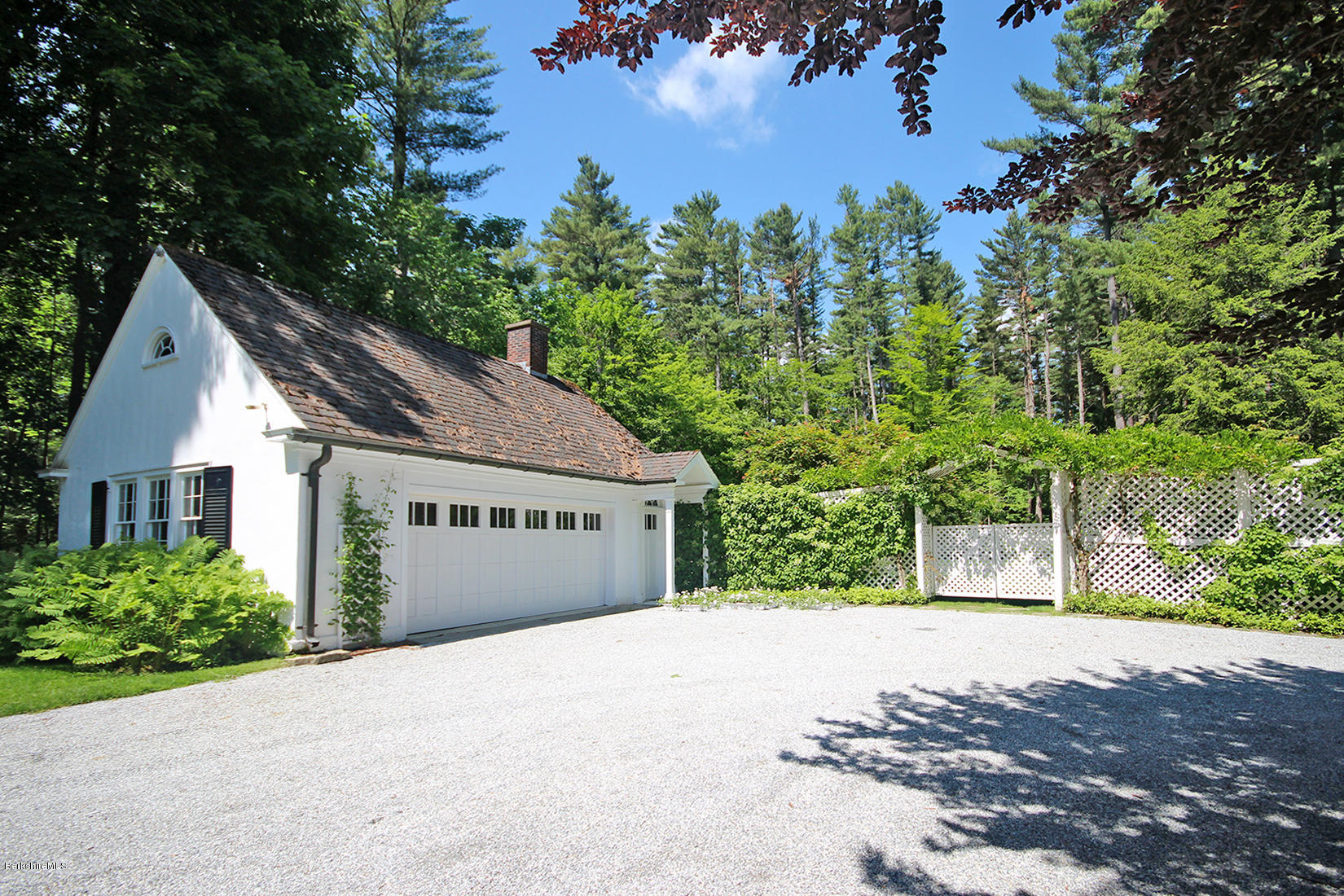 6 Glendale Road Stockbridge, MA 01229 - Photo 5 of 45 a front view of a house with a yard and garage