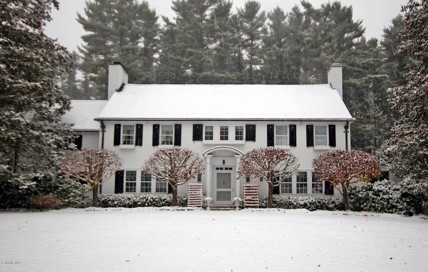 6 Glendale Road Stockbridge, MA 01229 - Photo 42 of 45 a front view of a house with a yard covered in snow