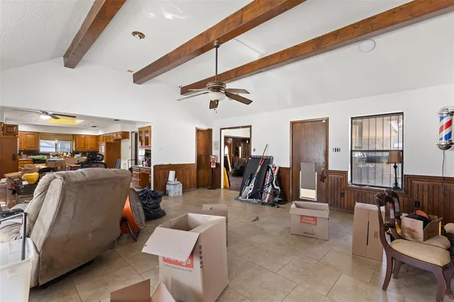 a bathroom with a granite countertop toilet sink and mirror