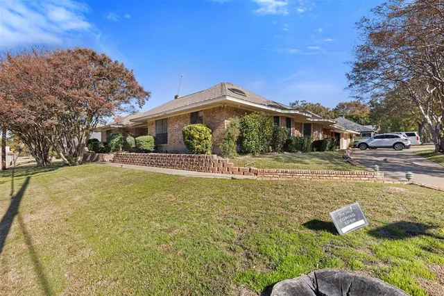 a swimming pool with outdoor seating and yard