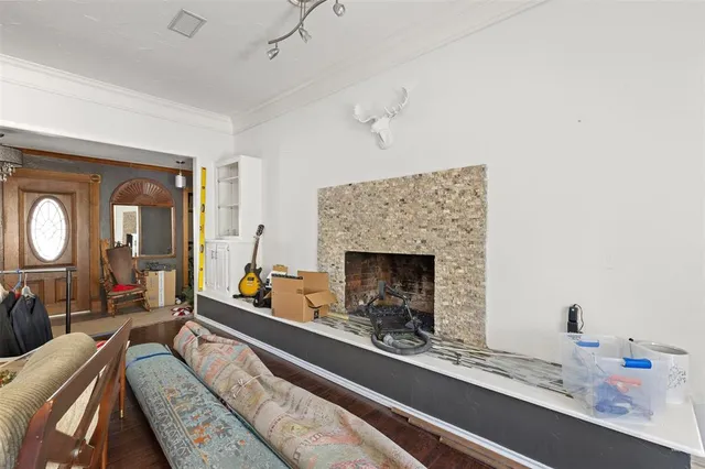 a living room with furniture and a fireplace
